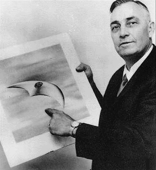 Kenneth Arnold with a drawing of what he saw